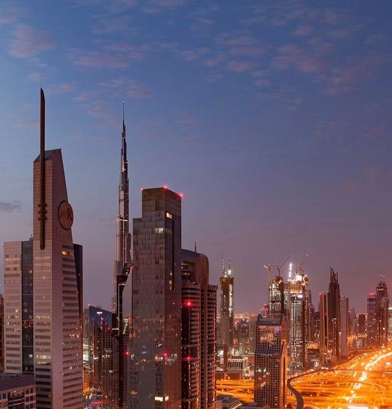 Dubai high-rise towers at dusk (illustrative photo) – not a photo of Jumeirah Village Circle