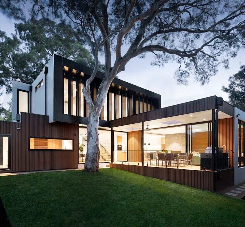 Contemporary villa exterior with lawn at dusk (illustrative photo) – not a photo of Remraam