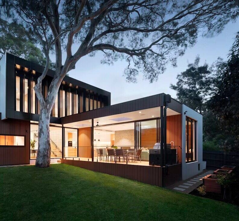 Contemporary villa exterior with lawn at dusk (illustrative photo) – not a photo of DAMAC Hills 2